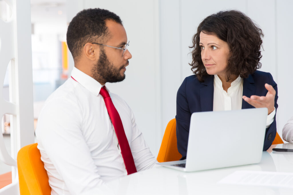 Mentor explaining project specific to intern